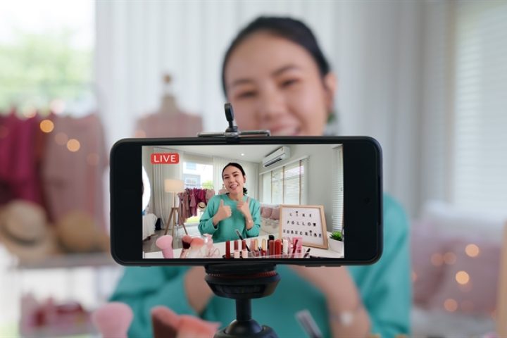 Asia woman micro influencer record live viral video camera at home studio. Happy fun talk speak advice review hobby in media. Vlogger selfie shoot enjoy work show smile teach like share app.
